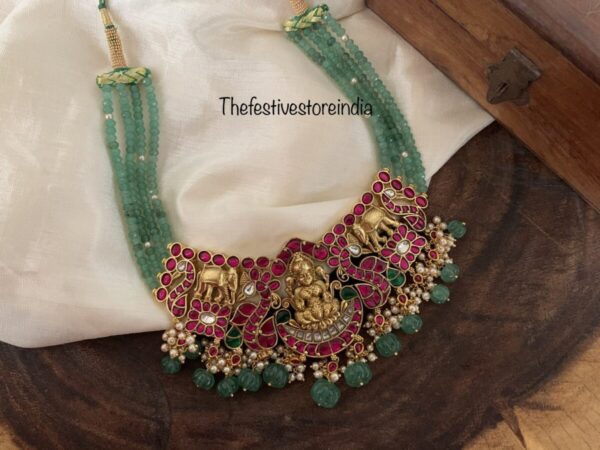 Green jadau lakshmi ambaari necklace with pumpkin bead drops