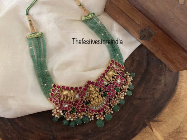 Green jadau lakshmi ambaari necklace with pumpkin bead drops