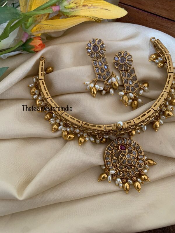 All white attigai style red tikka choker set