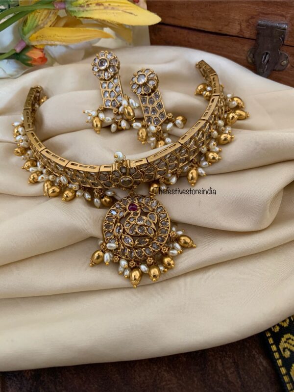 All white attigai style red tikka choker set