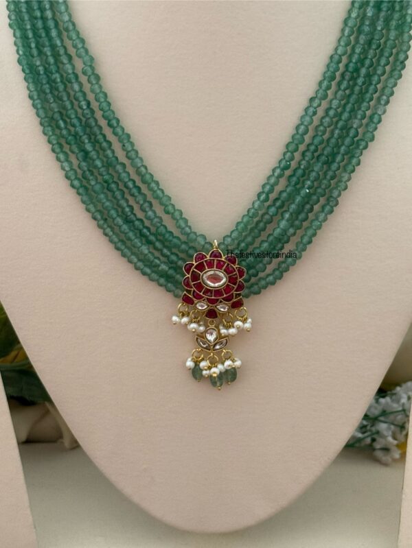 Classic Mid length Jadau pendant green haaram with screwback earrings