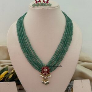 Classic Mid length Jadau pendant green haaram with screwback earrings
